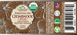 US Organic Cedarwood Atlas essential oil 10 mL wraparound label with safety information and barcode.