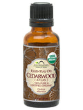 US Organic Cedarwood Atlas essential oil, 30 mL amber bottle with black cap and brown floral label.