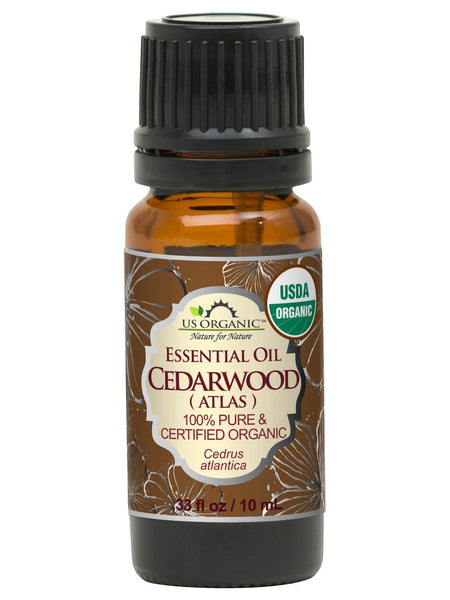 US Organic Cedarwood Atlas essential oil, 10 mL amber bottle with black cap and brown floral label.